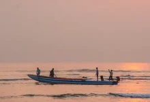 Visakhapatnam Fishing Harbour boat accident where Marine Police rescued fishermen after a fishing boat overturned.