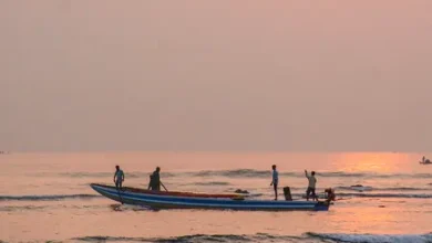 Visakhapatnam Fishing Harbour boat accident where Marine Police rescued fishermen after a fishing boat overturned.