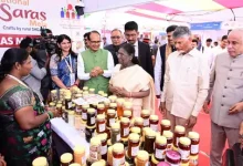 President Droupadi Murmu interacting with rural women entrepreneurs at the National SARAS Mela in Vijayawada